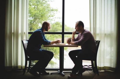 Men talking over coffee